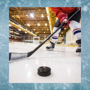 Older child playing Ice hockey picturing player holding stick and puck on indoor rink.  Framed by picture of blue ice