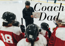 Ice Hockey Coach Dad. Picture of Coach showing team a play