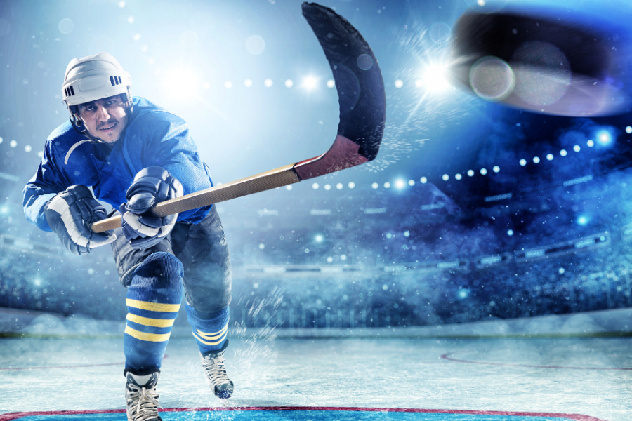 Ice Hockey player taking a slap shot 