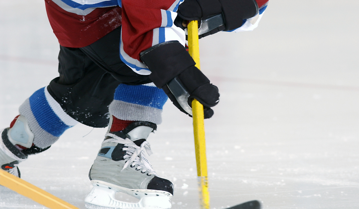 Ice Hockey player making a pass for an Assits