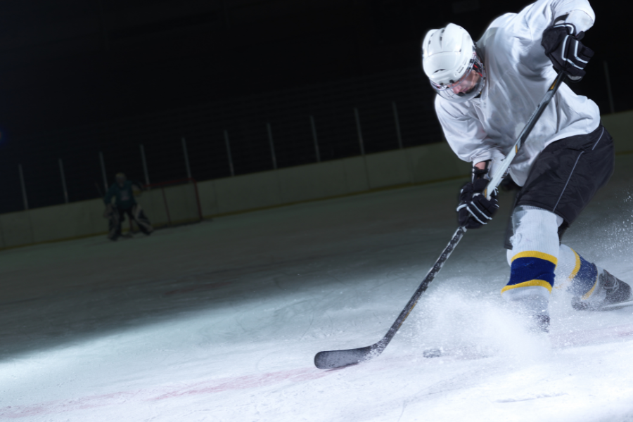 Hockey player making shot on goal