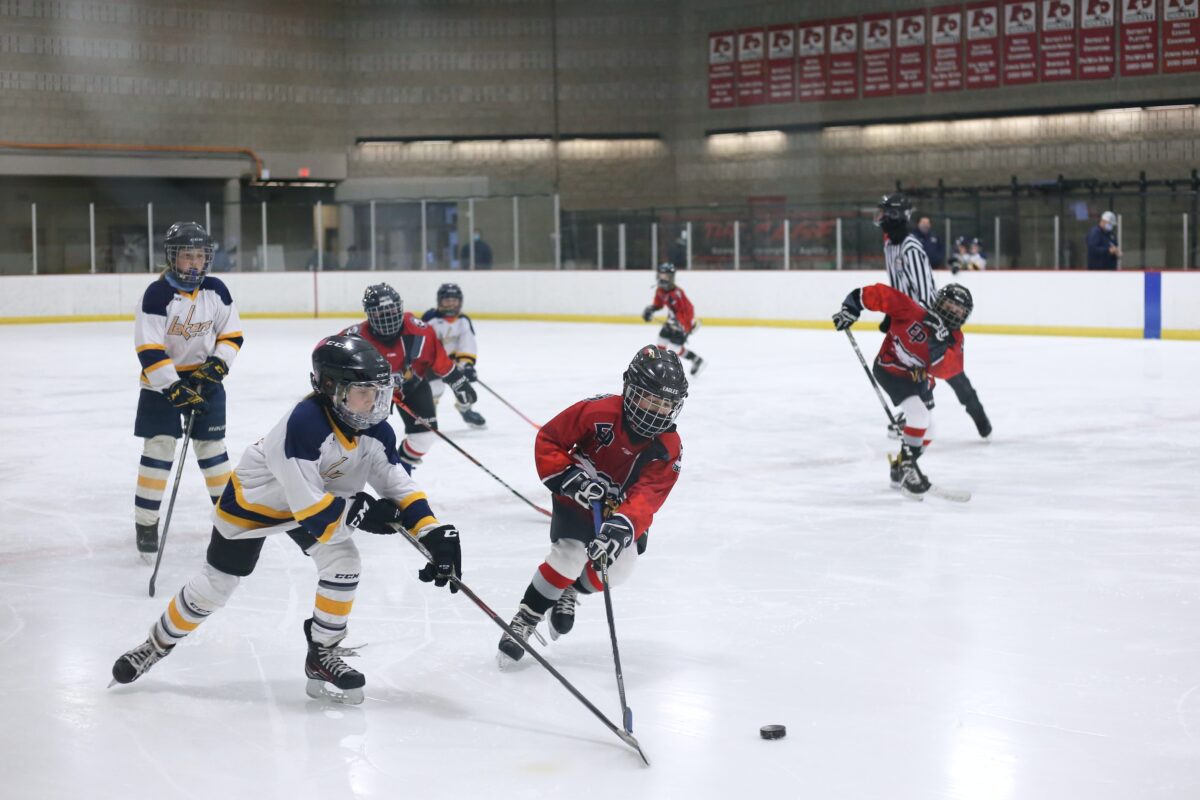 two youth teams playing ice hockey